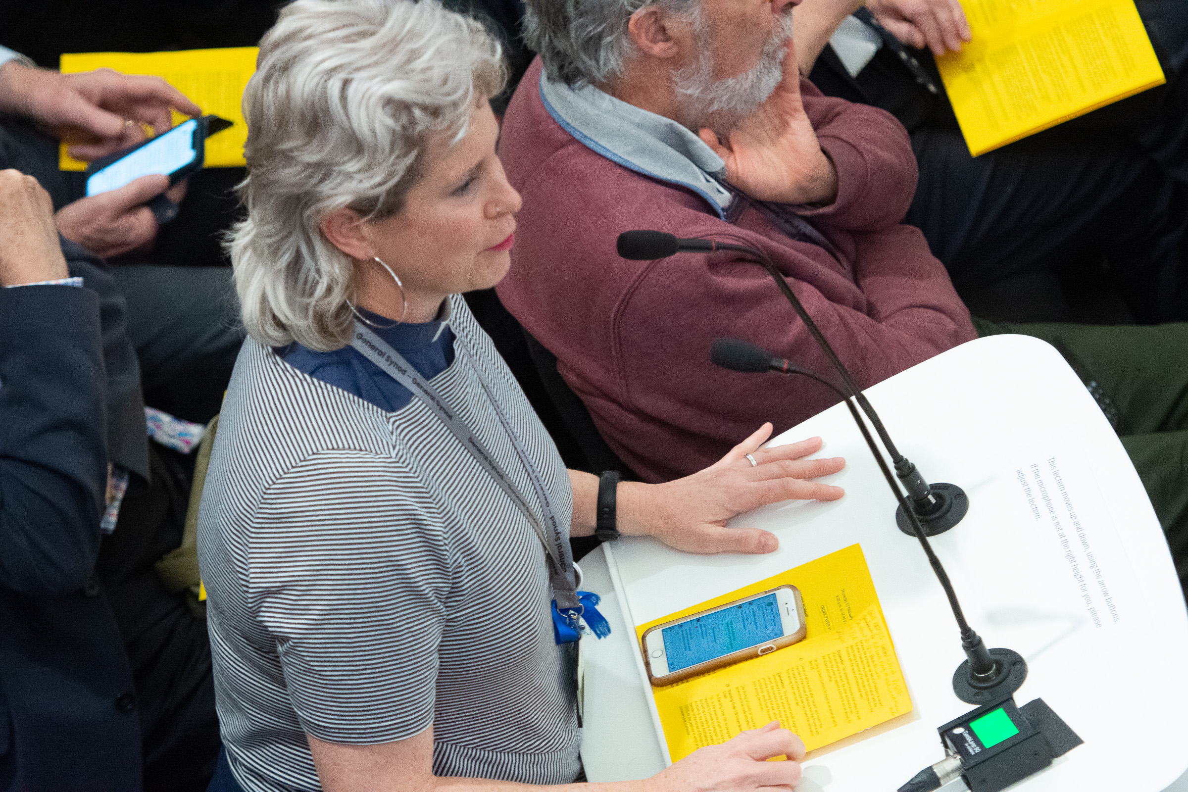 Rachel Webbley speaking into a microphone at Synod